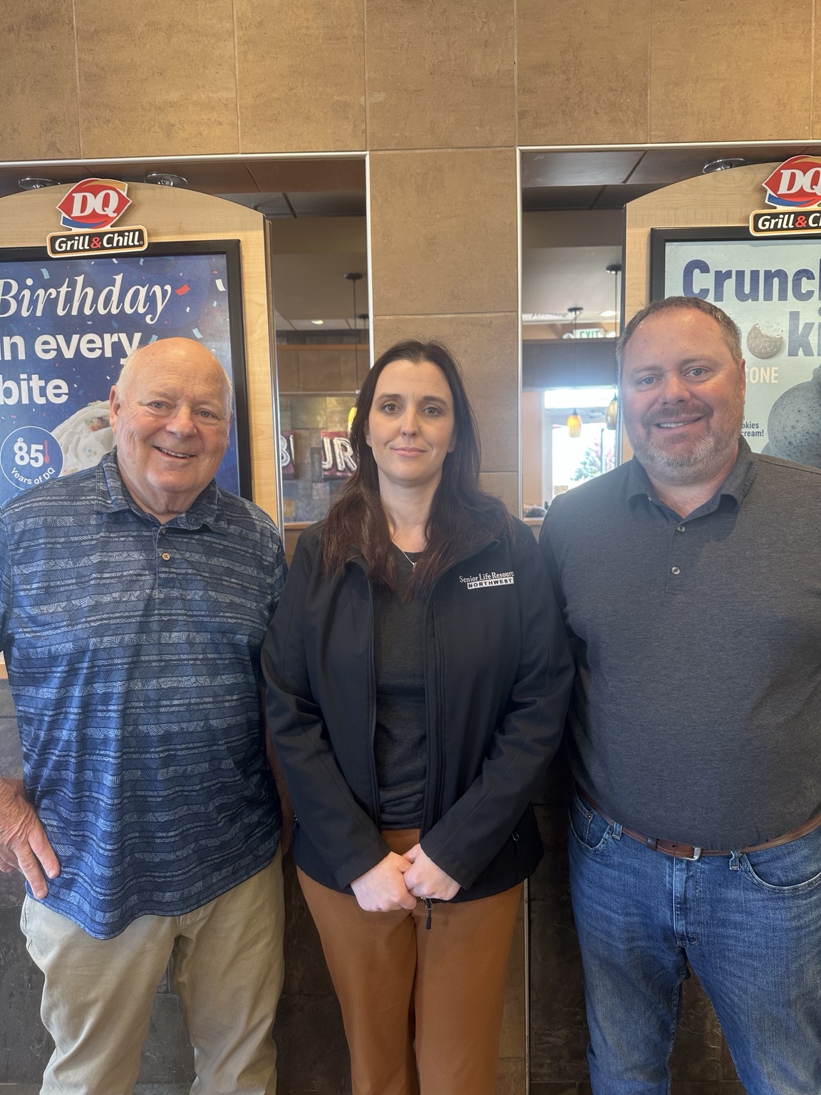 Amanda Le Blanc centered with two community partners